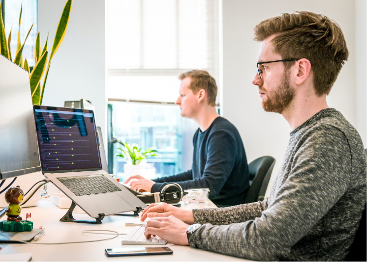 People Working At Desk